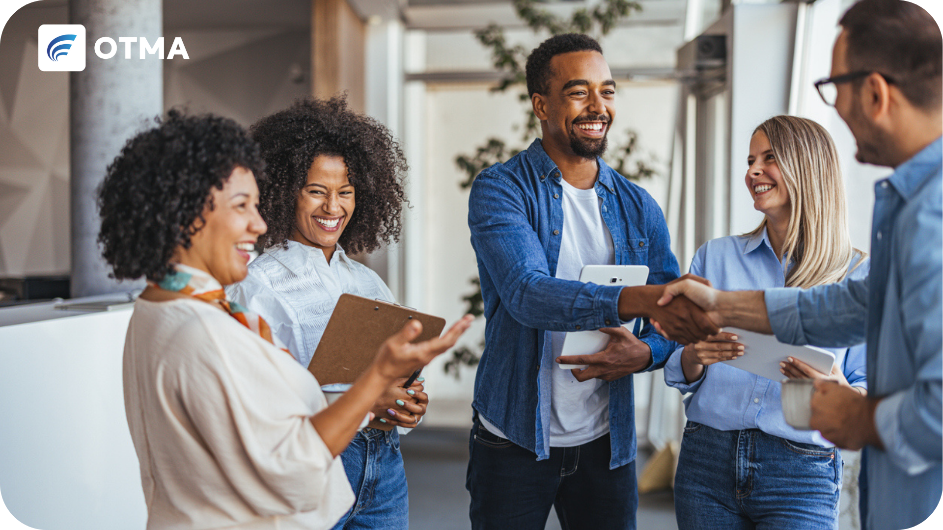 Team of professionals shaking hands. What is an apprenticeship?