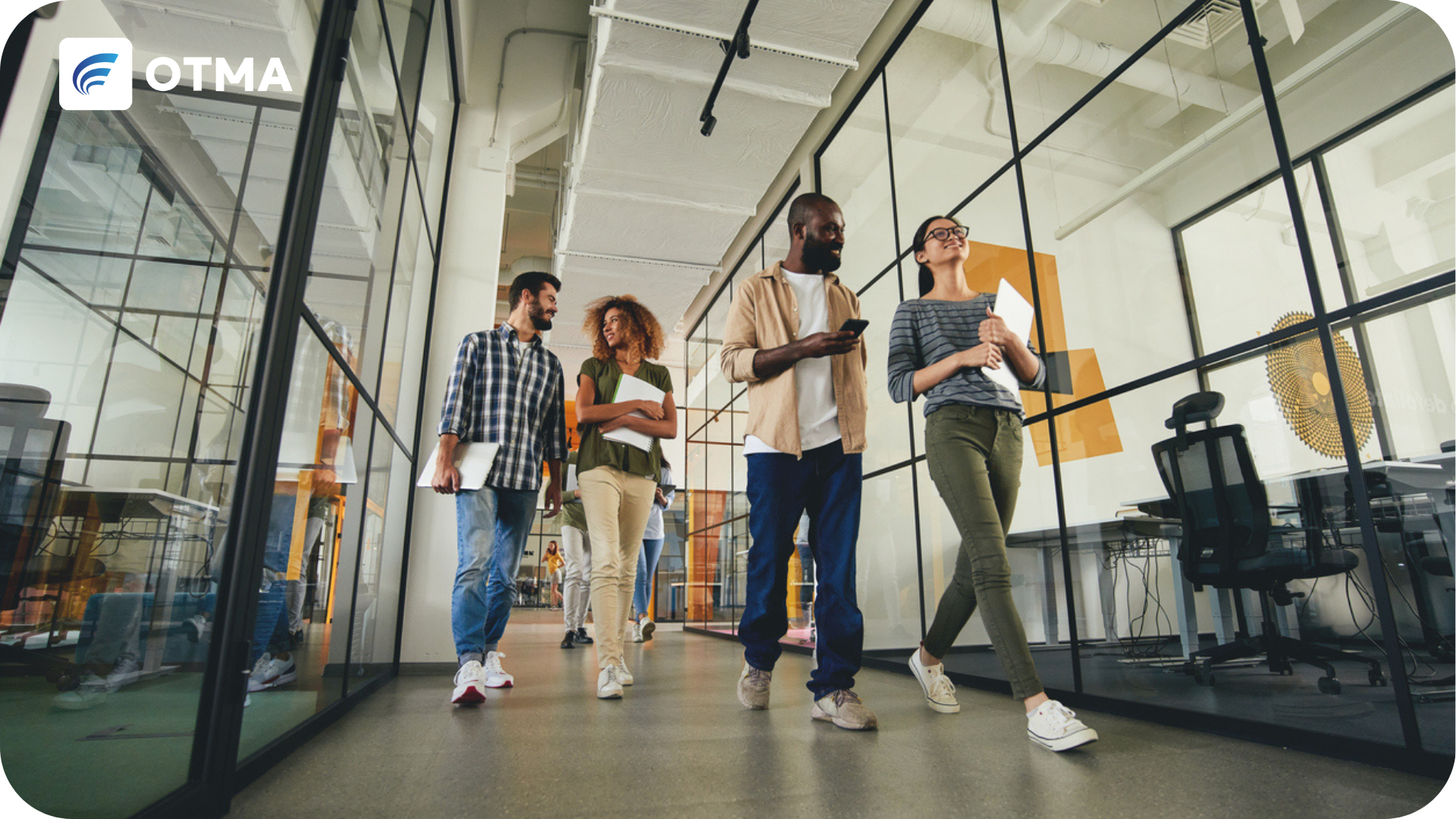 Apprenticeship Funding Guidance - shwoing professionals walking down a corridor together while working as an apprentice
