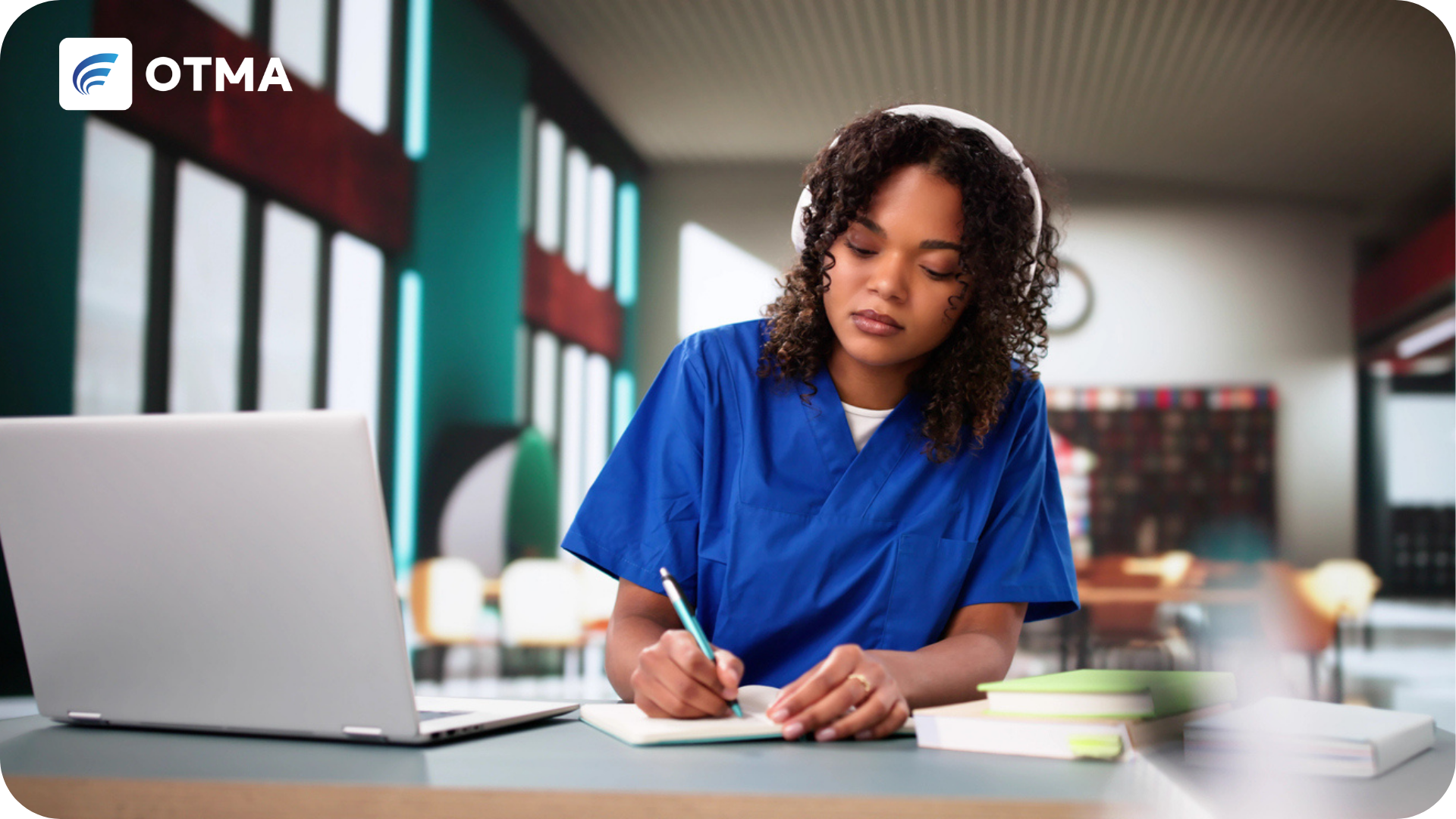 Professional Development shown by a lady training as a nurde by studing over a laptop with a notebook and headphones